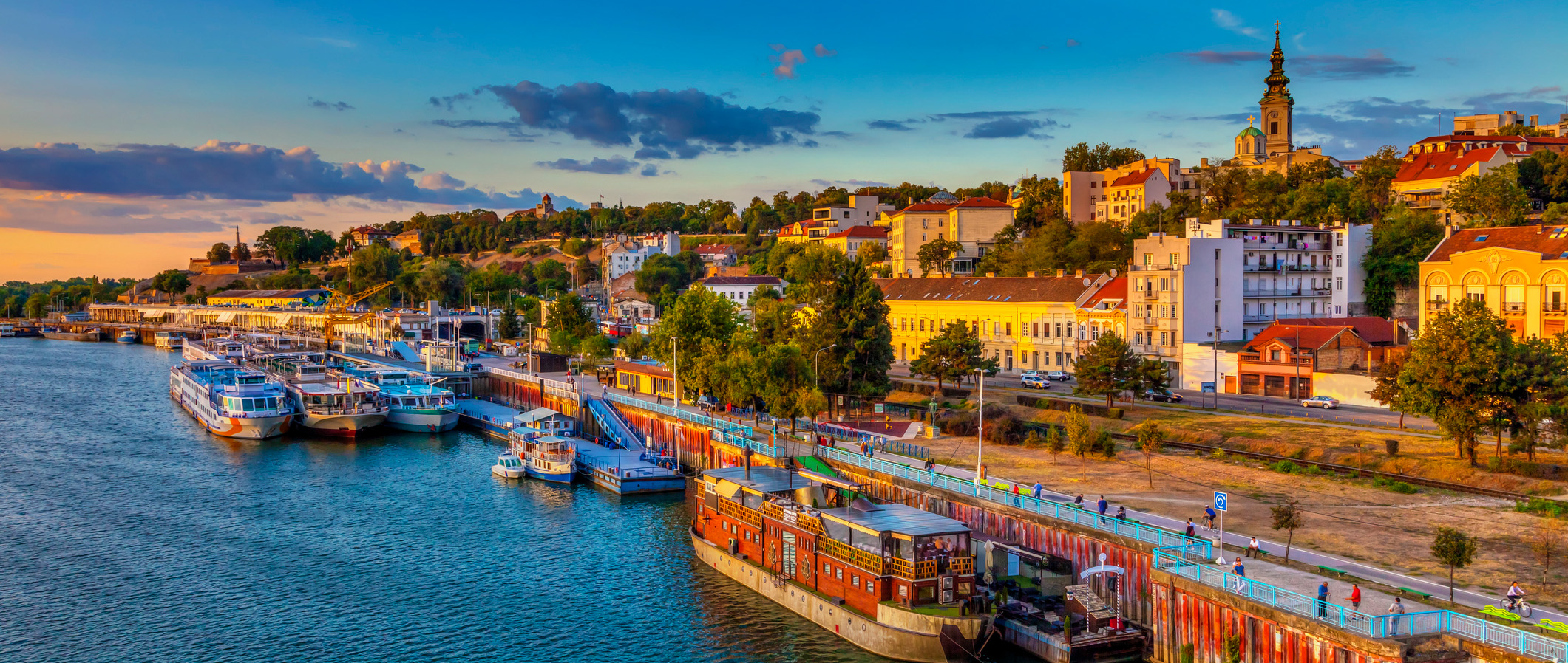 Sunset over Belgrade and ships in the harbor. HDR image